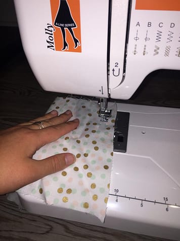 Fabric and a plan are all you need to make protective masks. A sewing machine can help as well. 