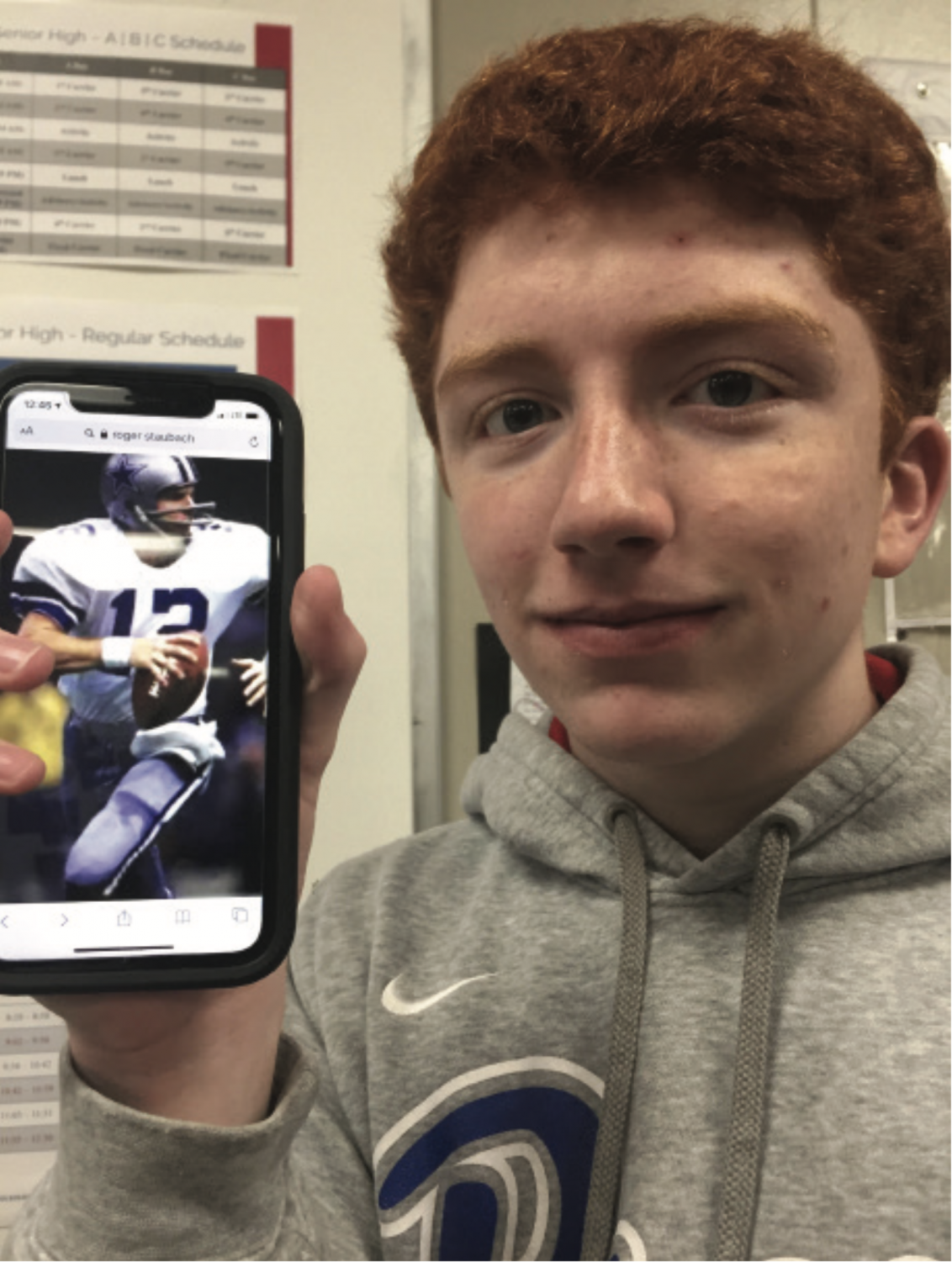 Sophomore Jake Vineyard holds up a picture of Roger Staubach.