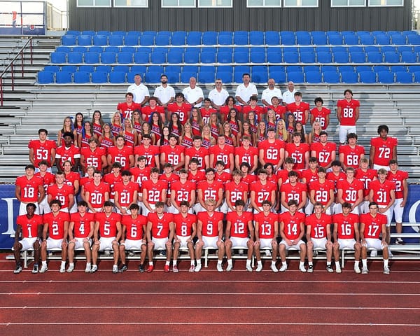 The varsity football team with cheerleaders and coaches. Photo courtesy of Jackson Prep.